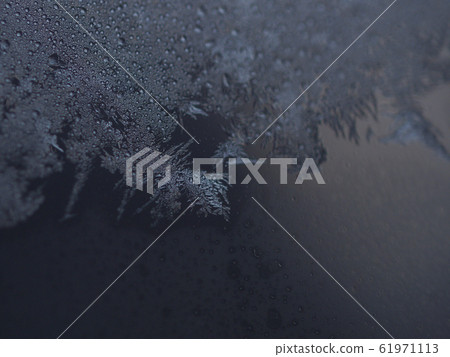 Ice crystal dark background upper half 61971113