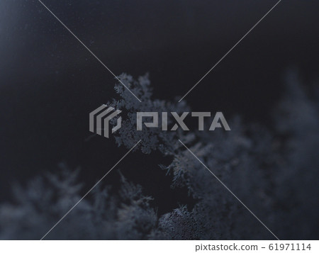 Ice crystal dark background center 61971114