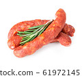 Stack of cooked sausages close-up isolated. 61972145