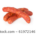 Stack of cooked sausages close-up isolated. 61972146