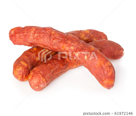 Stack of cooked sausages close-up isolated. 61972146