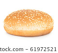 Burger bun with sesame seeds isolated on white. 61972521