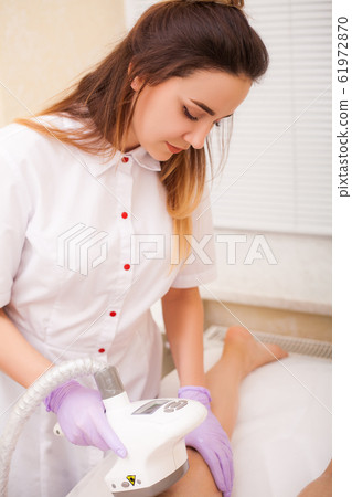 Woman getting LPG hardware massage at the beauty clinic Woman getting LPG hardware massage at the beauty clinic 61972870