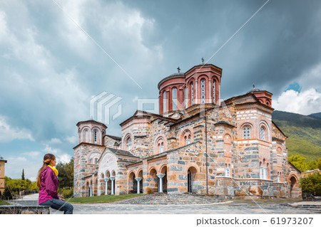 Tourist woman visiting the monastery of Timios Prodomos in Greece 61973207