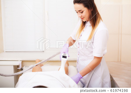 Woman getting LPG hardware massage at the beauty clinic 61974198