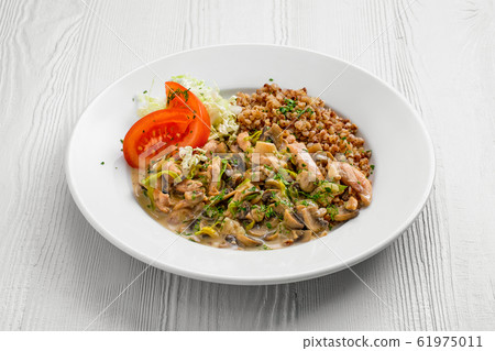 Plate with chicken goulash, mushroom, buckwheat Plate with chicken goulash, mushroom, buckwheat 61975011