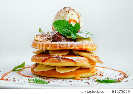 American pancakes with ice cream, banana and nut American pancakes with ice cream, banana and nut 61975039