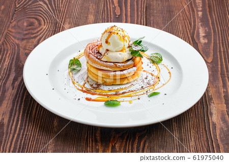 Pancakes with ice cream, whipped cream  61975040
