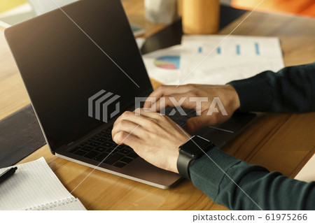 Male Hands Working On Laptop Typing At Workplace In Office Male Hands Working On Laptop Typing At Workplace In Office 61975266