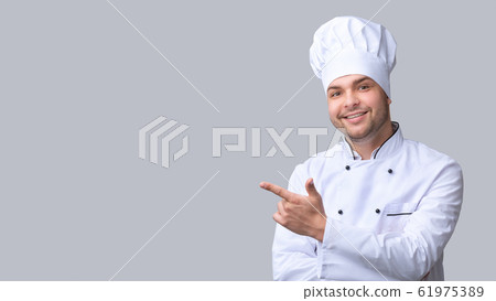Cook Man Pointing Finger Aside Over Gray Studio Background, Panorama Cook Man Pointing Finger Aside Over Gray Studio Background, Panorama 61975389