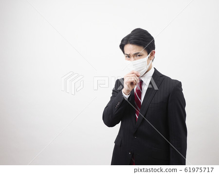 Businessmen coughing with a mask Businessmen coughing with a mask 61975717