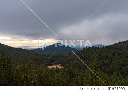 Forest and mountain landscape on a rainy day seen from Crater Lake Forest and mountain landscape on a rainy day seen from Crater Lake 61975993