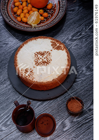 Close-up of a delicious cake with white cream Close-up of a delicious cake with white cream 61976149