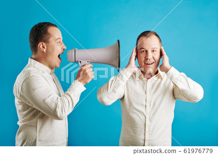 Man Shouting At Twin Brother Man Shouting At Twin Brother 61976779