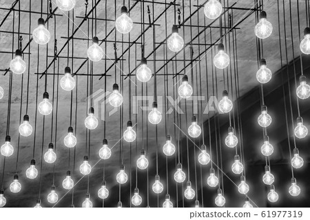 Cold light on gray ceiling. Beautiful retro edison light lamp decor, light lamp electricity hanging Cold light on gray ceiling. Beautiful retro edison light lamp decor, light lamp electricity hanging 61977319