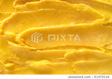 Top view of soft mango sorbet surface 61979128