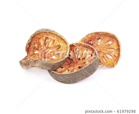 Dry Bael fruit - Slices of dry Bael fruit isolated on white  background 61979298