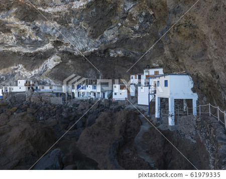 Cueva de Candelaria, Pirate cave Poris de Candelaria, small hidden fisherman village with white and blue houses, tourist attraction near Tijarafe, La Palma, Canary islands, Spain Cueva de Candelaria, Pirate cave Poris de Candelaria, small hidden fisherman village with white and blue houses, tourist attraction near Tijarafe, La Palma, Canary islands, Spain 61979335