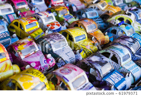 Colorful toy cars made from aluminium drink cans on sale at a market stall, Antananarivo, Madagascar Colorful toy cars made from aluminium drink cans on sale at a market stall, Antananarivo, Madagascar 61979371