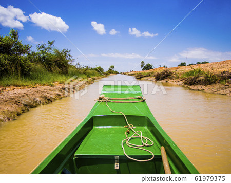 Exploring Tonle Sap lake and its channels with typical long tail boat, Siem Reap Province, Cambodia Exploring Tonle Sap lake and its channels with typical long tail boat, Siem Reap Province, Cambodia 61979375