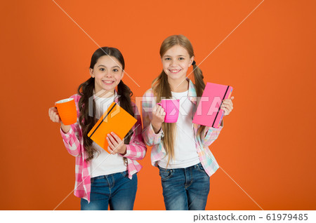 Reading pleasant activity. Girls kids with books Reading pleasant activity. Girls kids with books 61979485