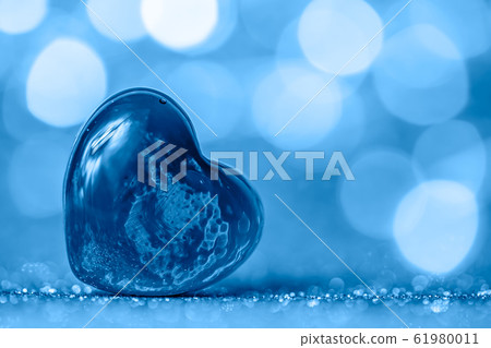 transparent heart against the background of the lights. trend colour 2020 classic blue transparent heart against the background of the lights. trend colour 2020 classic blue 61980011