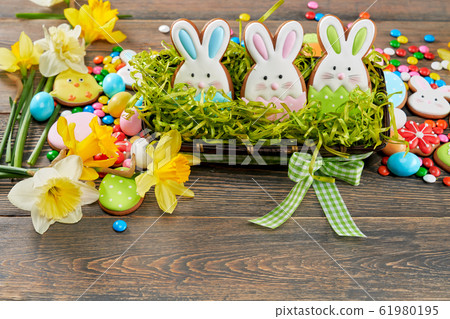 Easter ginger cookies in box with grass. Easter ginger cookies in box with grass. 61980195