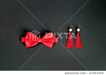 Red bow tie and earings lat lay for 14 February date Red bow tie and earings lat lay for 14 February date 61981849
