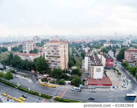 Istanbul cityscape-brown roof houses and modern glass skyscrapers and mosques in the distance Istanbul cityscape-brown roof houses and modern glass skyscrapers and mosques in the distance 61981908