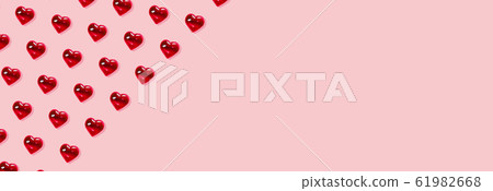 Valentine's day background. Pattern of glass red hearts on a pastel pink background. Card minimalism, Symbol of love Banner 61982668