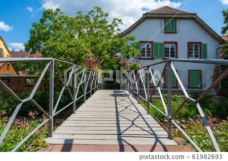 View over a small footbridge over the tributary View over a small footbridge over the tributary 61982693