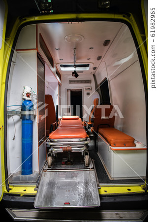 Medical ambulance car with stretcher and equioment inside. Medical ambulance car with stretcher and equioment inside. 61982965