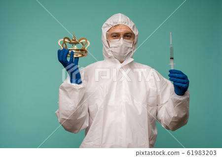 A male doctor in protective overalls and a mask A male doctor in protective overalls and a mask 61983203