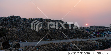 Polluted water and mountain large garbage pile and pollution Polluted water and mountain large garbage pile and pollution 61983397