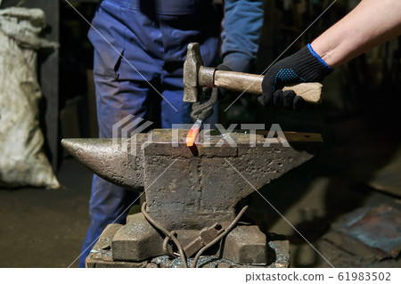 traditional metal forging in a forge 61983502