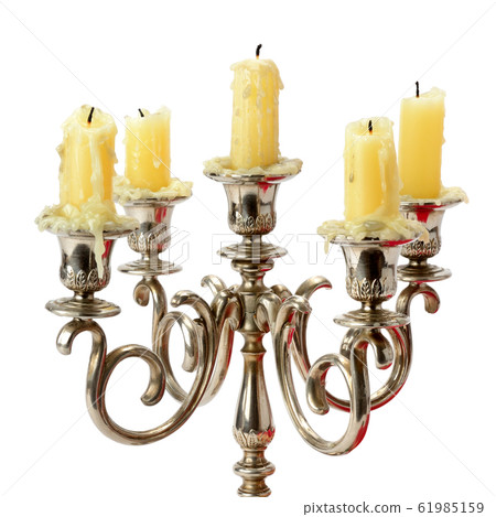 Vintage candelabras with wax candles isolated on Vintage candelabras with wax candles isolated on 61985159