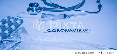 New coronavirus-2019-nCoV. Medical blue background with inscription coronavirus, stethoscope, pills, thermometer, syringe. New coronavirus-2019-nCoV. Medical blue background with inscription coronavirus, stethoscope, pills, thermometer, syringe. 61985502