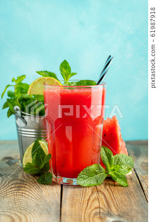 Watermelon slushie with lime and mint. 61987918