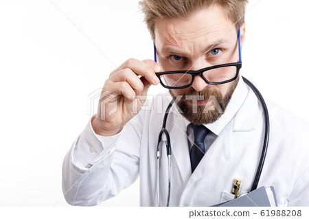 Close-up of Young Bearded Doctor With Stethoscope Close-up of Young Bearded Doctor With Stethoscope 61988208