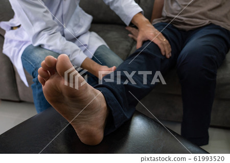 instructor assisting senior doing exercise working 61993520