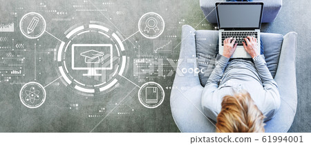 E-learning concept with man using a laptop 61994001