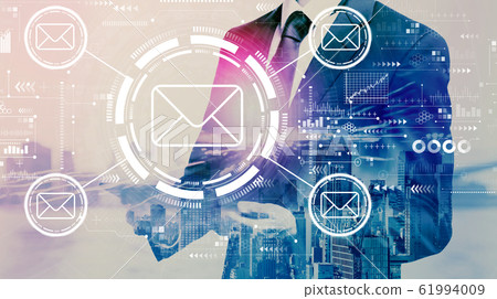 Email concept with businessman holding a tablet 61994009