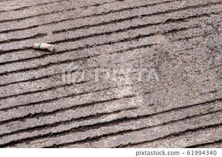 The cigarette butt let down on the concrete floor The cigarette butt let down on the concrete floor 61994340