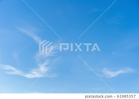 Blue sky and white puffy clouds Blue sky and white puffy clouds 61995357