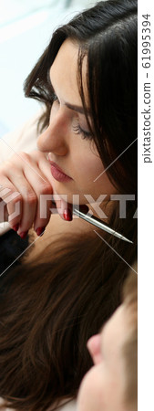 Businessman and businesswoman review graph 61995394