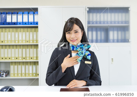 Business woman, window, reception Business woman, window, reception 61996850