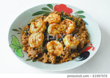 Stir fried minced pork and shrimps with basil. 61997976