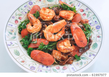 Stir fried Noodle with black soy sauce. 61997977