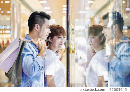 Couple Looking At Shop Display 62005643