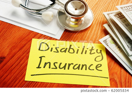 Disability Insurance memo sign with money. 62005834